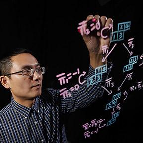 Professor writing on lightboard